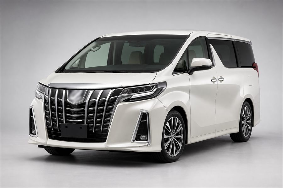 White Japanese luxury MPV people carrier photographed in a studio